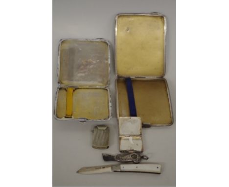 Two engine turned silver cigarette cases; together with a silver bladed mother of pearl fruit knife; a sterling silver covere