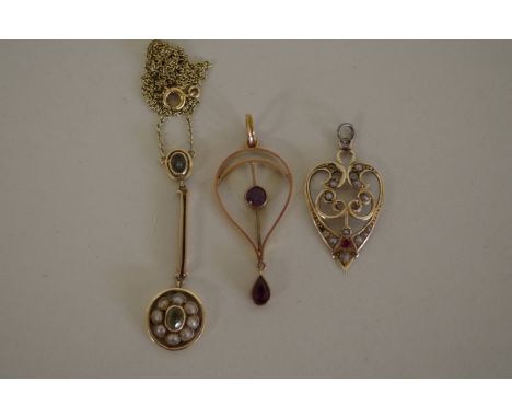 An 9ct gold Edwardian pendant set amethysts; together with a similar example set pearl and ruby; and an unmarked Edwardian pe
