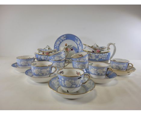 An early 19th Century Spode china tea service with boat shaped teapot,  having hand painted sprigs of flowers, and plant life