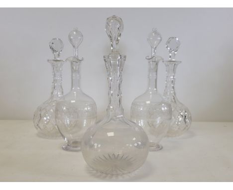 A late 19th or early 20th Century glug - glug decanter of waisted form,  and pontil mark to base, height 33cm, together with 