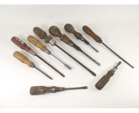 A selection of 20th Century woodworking hand tools,  a mixture of different sized screwdrivers, nearly all with wooden handle