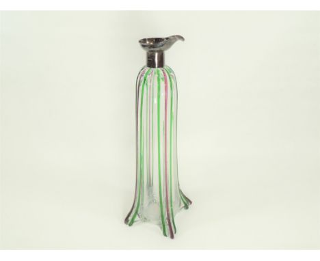 An early 20th Century silver collared and spouted decanter, on splayed feet, with trails of purple and green glass, hallmarke