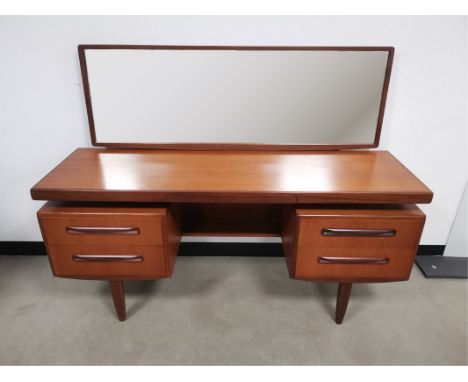 Mid 20th Century G-plan teak mirror backed dressing table, with rectangular adjustable mirror raised on two supports (current