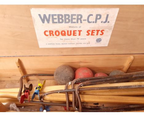 A boxed vintage croquet set by 'Webber C.P.J' ,  consisting of four mallets, balls, stakes, blue, red, yellow and black metal