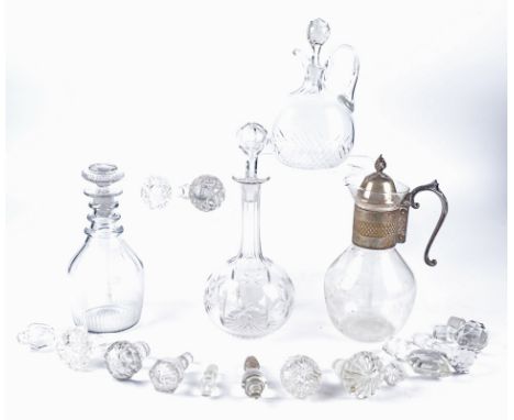 A club shaped decanter together with a bulbous example,  height of the tallest 32cm, two claret jugs and a quantity of spare 
