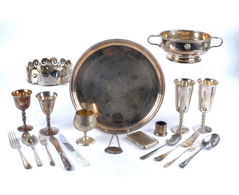 A collection of silver plate, including cutlery, beakers, a double handled tureen, circular tray, cigarette case and more (pa