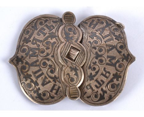 A Russian silver niello belt buckle,   decorated with script and scrolls, with dagger fastener, 28g 