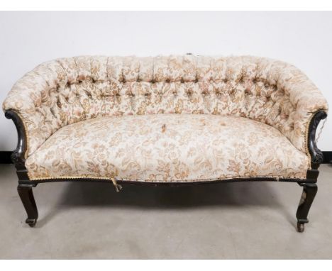 19th Century button backed settee, with woven floral upholstery, raised on four wooden legs having castor to each. 148cm x 76