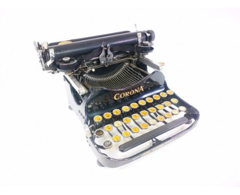 Corona portable folding typewriter, together with carry case. 27cm x 26cm x 15cm when assembled. 
