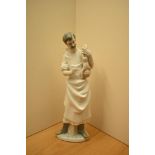 A large Lladro porcelain figure group number 4763, 'Obstetrician' Doctor with new born baby,