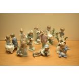 An assortment of Nao by Lladro porcelain figurines comprising 'First Love' No 1136, 'Girl Running