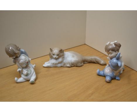 A group of three Nao by Lladro porcelain figures comprising 'Angora Cat' number 113, 'I Love You So Much' number 1263 and 'Go