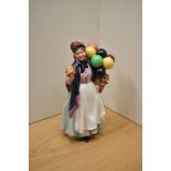 A Royal Doulton bone china figure 'Biddy Penny farthing' HN 1843.