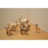 A small collection of Beswick Pottery, comprising a goat, number 1035, designed by Arthur Gredington
