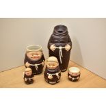 A selection of Goebel porcelain monks comprising egg cup, mug, condiment pot etc.