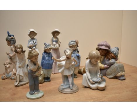 An assortment of Lladro and Nao by Lladro porcelian figurines comprising 'A Sweet Gesture' number 2441, 'Who's There?' number