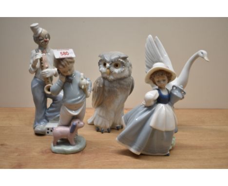 Four Nao by Lladro figurines comprising 'Short Eared Owl' number 712, 'Someone is Calling You' number 1881, 'Taking Flight' n
