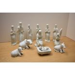 A thirteen piece carved white marble nativity scene to include the three wise men and three