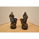 Two small vintage terracotta figures depicting both male and female fishermen, markings to front and
