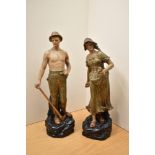 A pair of vintage Austrian Panked terracota figures depicting a shepherd and a lady feeding the
