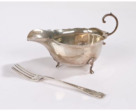 Victorian silver dessert fork, London 1873, makers marks rubbed, the foliate handle initialled RG, George V silver sauceboat,