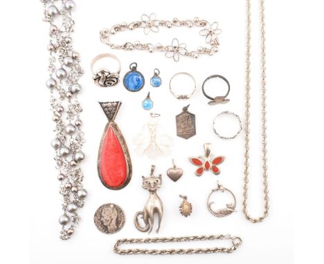 A collection of silver jewellery. The jewellery to include three silver rings including a Claddagh ring, a clover ring and a 