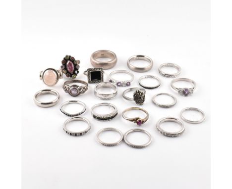A collection of silver rings. The rings to include band rings, pink, purple, AND black cabochon and faceted gem set rings, cr