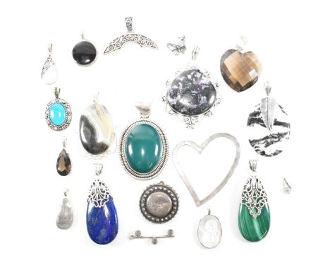 A collection of silver and gem set necklace pendants. The silver necklace pendants to include a pierced silver heart, malachi