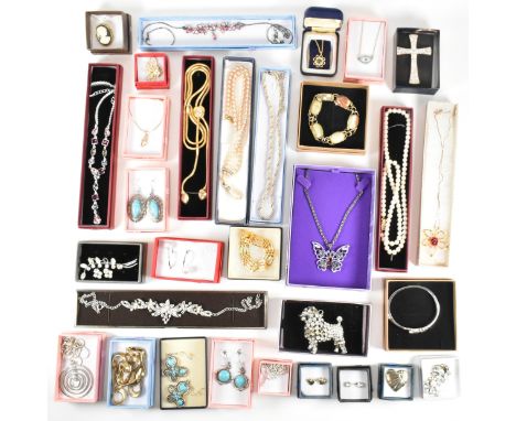 A large collection of costume jewellery. The two boxes of jewellery to include necklaces, earrings, bracelets, keyrings, broo