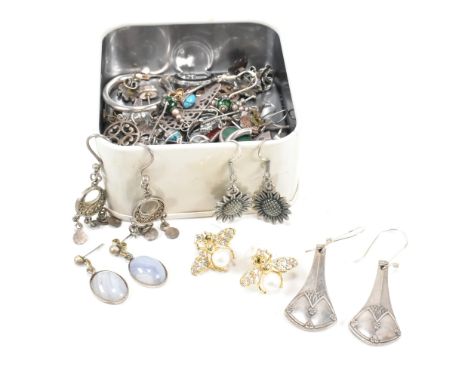 A collection of silver and silver plated earrings and a necklace pendant. The earrings to include silver hoops, stud earrings