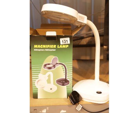New small table magnifying lamp. This lot is not available for in-house P&P.Condition Report: All electrical items in this lo