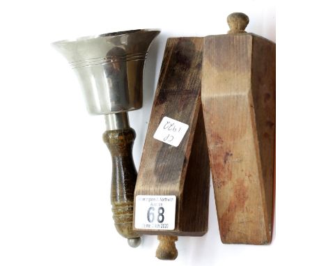 Wood handled chrome handbell marked England, H: 17 cm, and two wooden door wedges. P&amp;P Group 2 (£18+VAT for the first lot