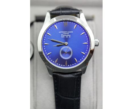 New boxed Anthony James blue dial steel wristwatch on a leather strap. P&amp;P Group 1 (£14+VAT for the first lot and £1+VAT 