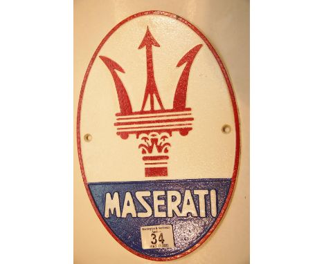 Cast iron Maserati wall sign, L: 29 cm. P&amp;P Group 2 (£18+VAT for the first lot and £2+VAT for subsequent lots) 