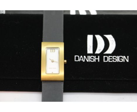 Danish Design ladies rectangular wristwatch with yellow metal bezel, quartz movement and original sleeves. P&amp;P Group 1 (£