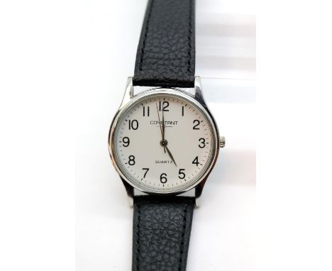 Constant stainless steel quartz wristwatch on a leather strap. P&amp;P Group 1 (£14+VAT for the first lot and £1+VAT for subs