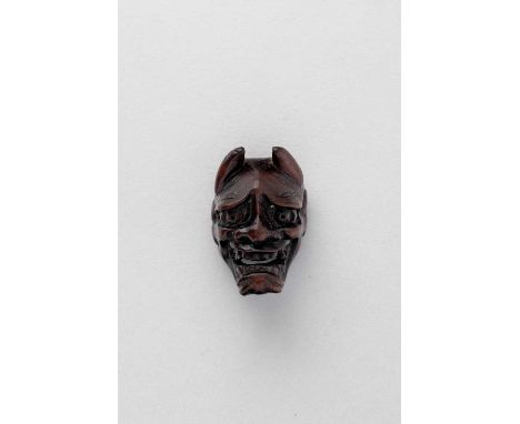 NO RESERVEA JAPANESE WOOD MASK NETSUKE OF HANNYA EDO PERIOD, EARLY 19TH CENTURY  Depicted grimacing with her gaping jaw revea