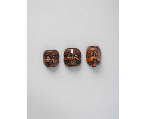 λ NO RESERVEλ THREE JAPANESE WOOD MASK NETSUKE EDO/MEIJI, 19TH CENTURY  One depicting a grimacing Noh mask, the back signed R