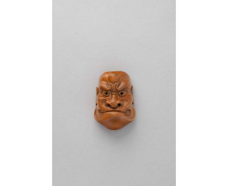 NO RESERVEA JAPANESE WOOD MASK NETSUKE OF BESHIMI EDO/MEIJI, 19TH CENTURY  Depicted with a furrowed brow and tight lips, the 