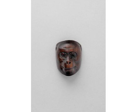 NO RESERVEA JAPANESE WOOD MASK NETSUKE OF SARU EDO/MEIJI, 19TH CENTURY  Naturalistically rendered with downcast eyes, the bac