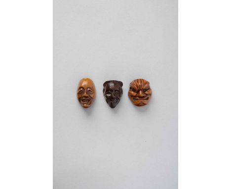 NO RESERVETHREE JAPANESE WOOD MASK NETSUKE EDO/MEIJI, 19TH CENTURY   One depicting a smiling face with residue of red pigment