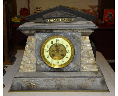 A late-19th century slate and marble mantel clock in the Egyptian style, of tapering form, the movement striking on a gong, 2