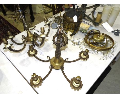 Three various gilt metal hanging light fittings, a glass and metal hanging lantern and two hanging light fittings with cut-gl
