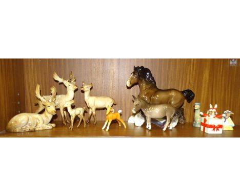 A Beswick deer family, comprising Stag-Standing (part of antler re-glued), Stag-Lying (one antler re-glued), Doe and Fawn, a 