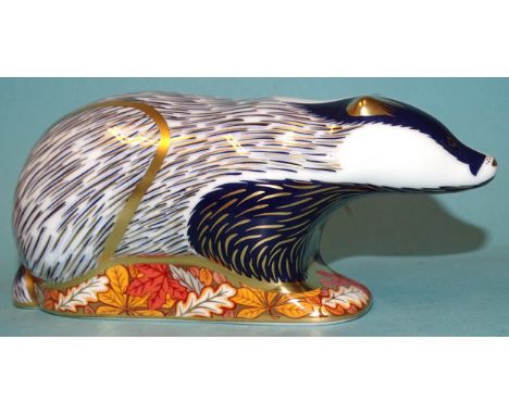 Three Royal Crown Derby ceramic paperweights: Woodland Badger (gold button, boxed), Mouse (gold button, boxed) and Badger (go