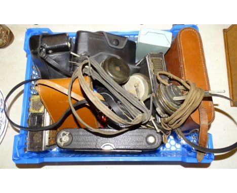 An Olympus OM10 camera in case, a Ricoh KR-10 camera, three folding cameras, a Carl Zeiss MC SI:3 5f=135 lens, three other ca