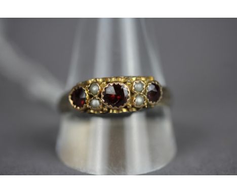 Silver ring, later set with garnets and seed pearls, size W