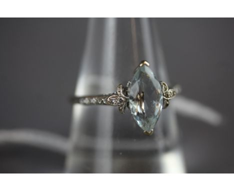 18ct white gold diamond and pale blue stone ring