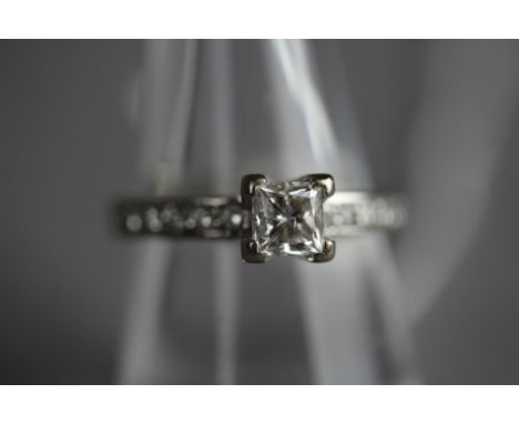 18ct white gold solitaire diamond ring, approx 0.5ct princess cut stone, with smaller diamonds to shank, ring size N