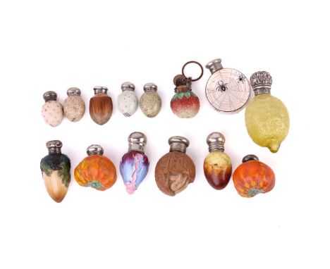 A good collection of ceramic and glass novelty scent bottles, modelled as fruit, nuts and eggs, 19th century and later, to in